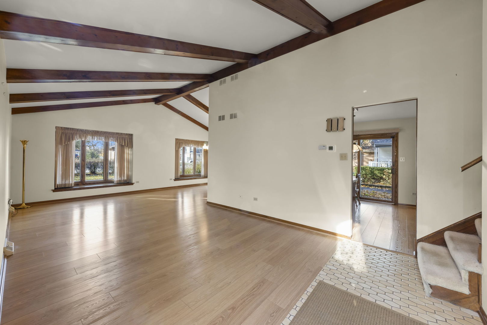 3068 Hickory Road Homewood, IL 60430 - Photo 3 of 44 a view of an empty room with wooden floor and a window