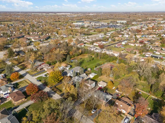 an aerial view of residential building with parking space