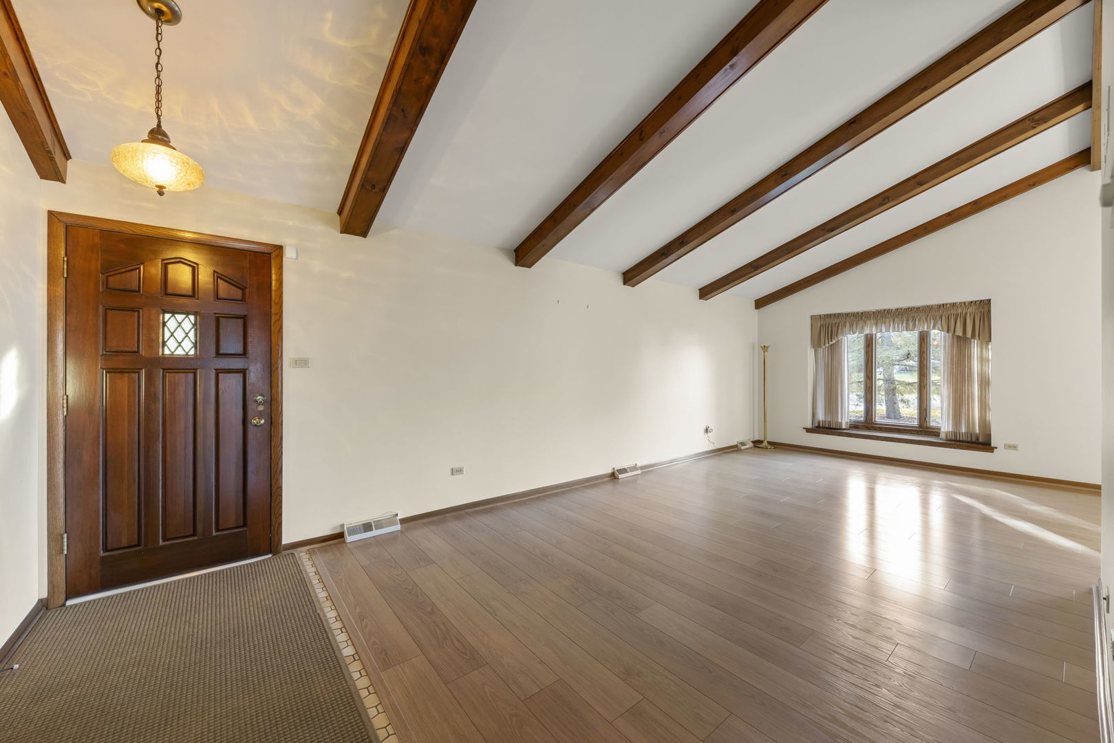 3068 Hickory Road Homewood, IL 60430 - Photo 4 of 44 a view of an empty room with wooden floor and windows