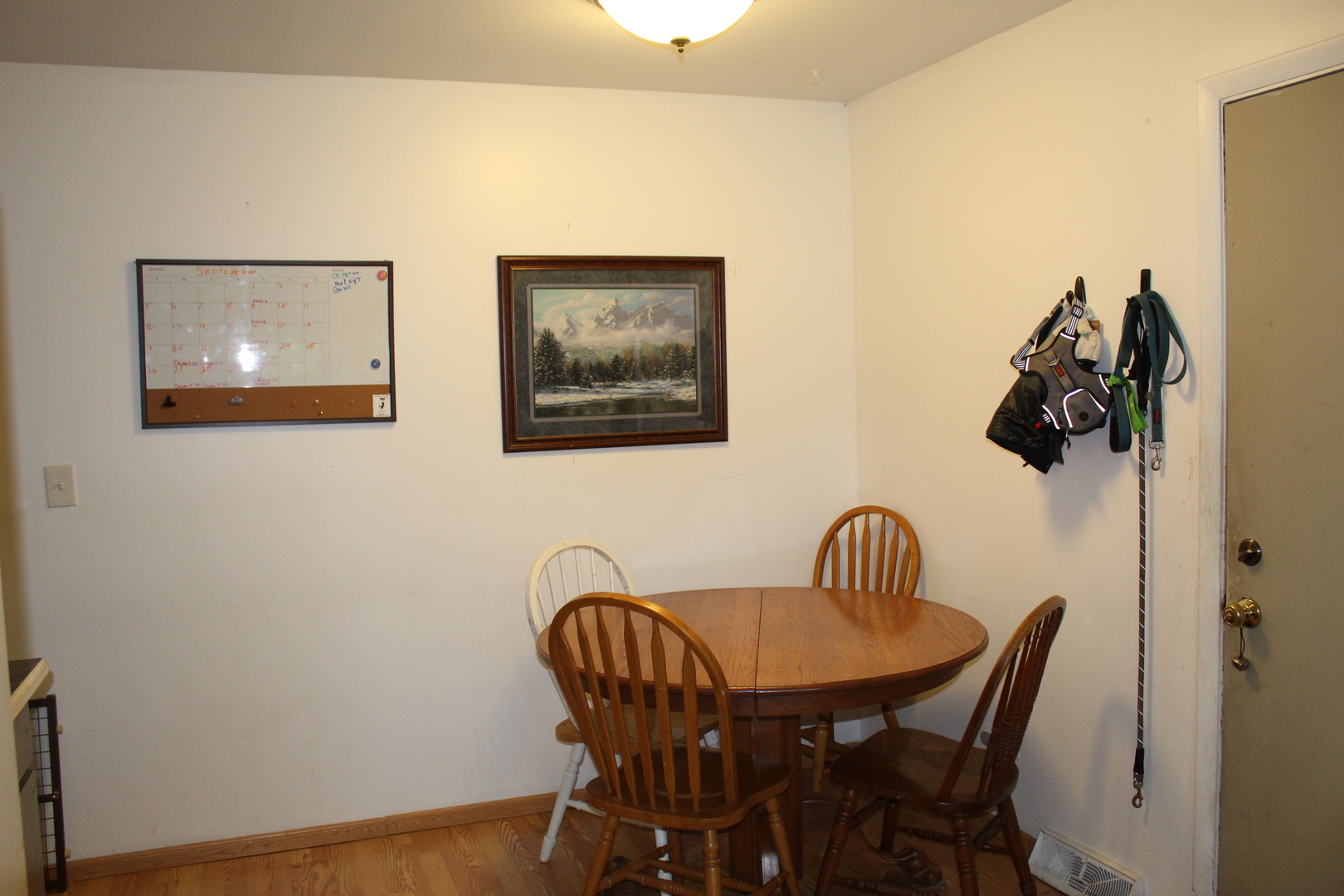414 Northgate Road Lindenhurst, IL 60046 - Photo 11 of 22 a view of a dining room with furniture and wooden floor