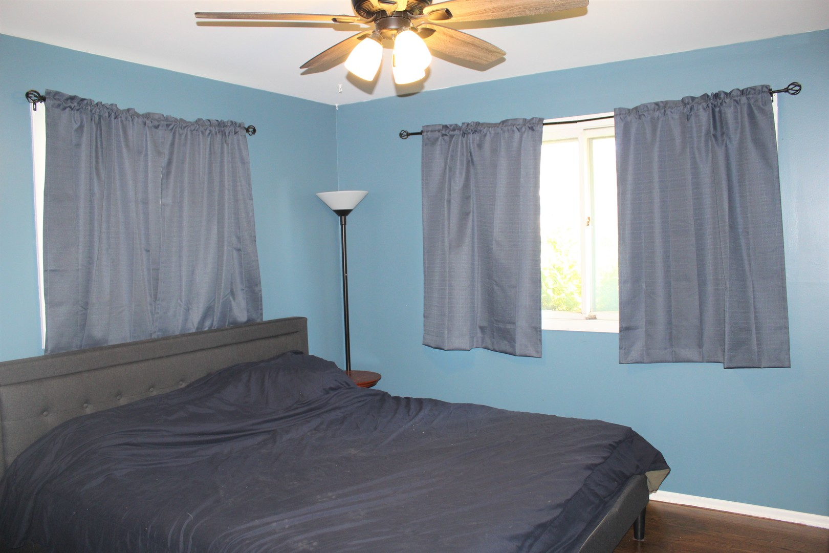 414 Northgate Road Lindenhurst, IL 60046 - Photo 13 of 22 a bedroom with a bed and a chandelier