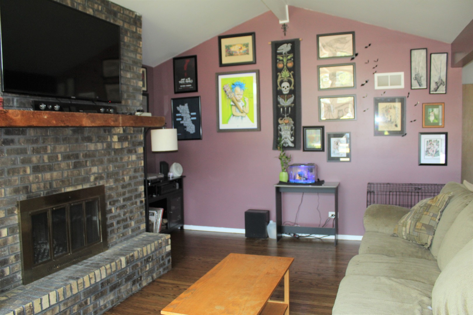 414 Northgate Road Lindenhurst, IL 60046 - Photo 7 of 22 a living room with furniture a flat screen tv and a fireplace