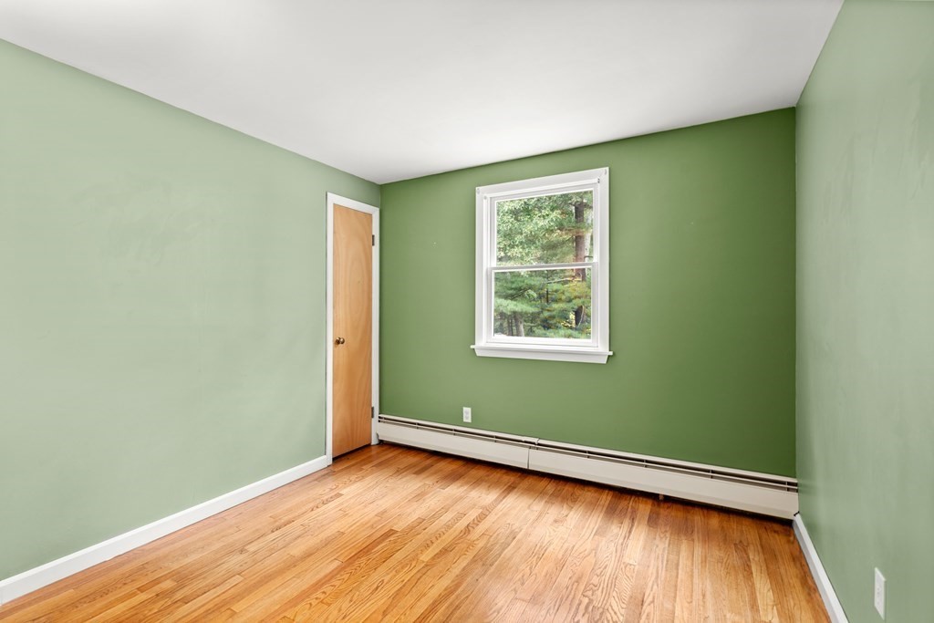 449 Potter Road Framingham, MA 01701 - Photo 14 of 25 a view of a room with wooden floor and a window