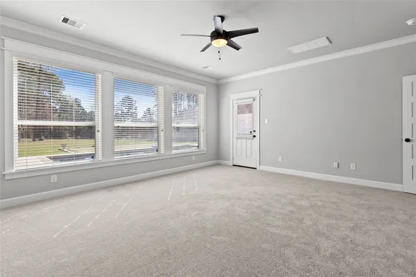 a view of empty room with windows