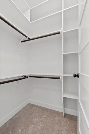 a view of an empty walk in closet