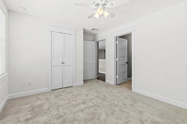 an empty room with a bathroom