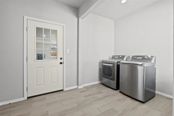 a utility room with washer and dryer
