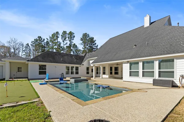 front view of a house with a swimming pool