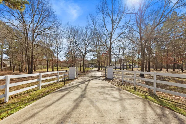 a view of park with wooden fence