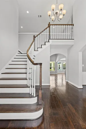 a view of entryway and hall with wooden floor