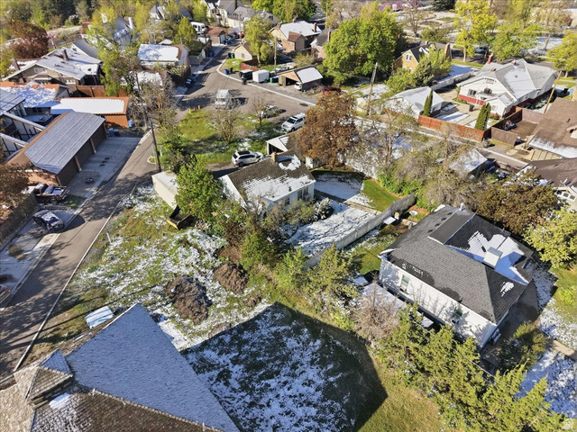 348 East 200 North Logan, UT 84321 - Photo 7 of 41 Aerial perspective showcasing residential properties with varied rooflines and surrounding green spaces