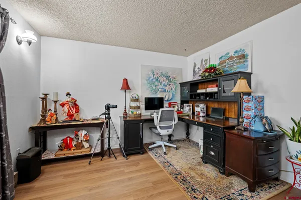 a view of a workspace with furniture and toys