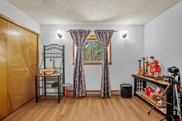 a view of a livingroom with furniture and wooden floor