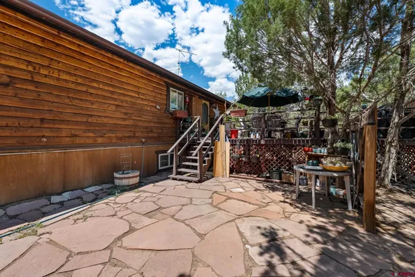 a view of a chairs and table in the patio