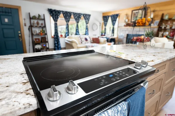 a kitchen with a stove and a sink