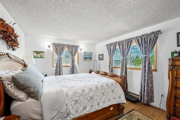 a bedroom with a bed window and a walk in closet