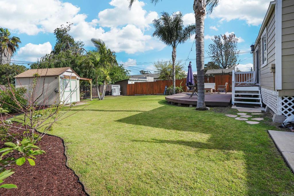 511 El Monte Road El Cajon, CA 92020 - Photo 13 of 30 a view of a backyard with a garden