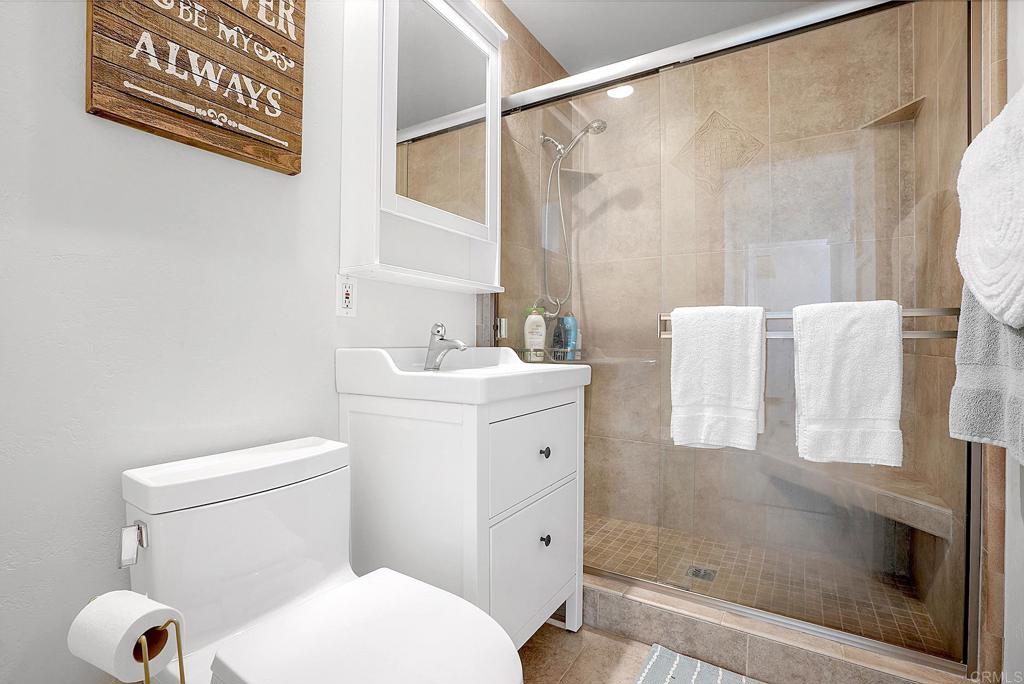 511 El Monte Road El Cajon, CA 92020 - Photo 26 of 30 a bathroom with a sink toilet and shower