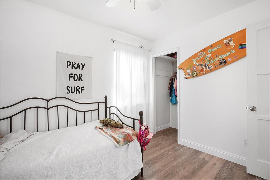 511 El Monte Road El Cajon, CA 92020 - Photo 27 of 30 a bedroom with a bed and a window