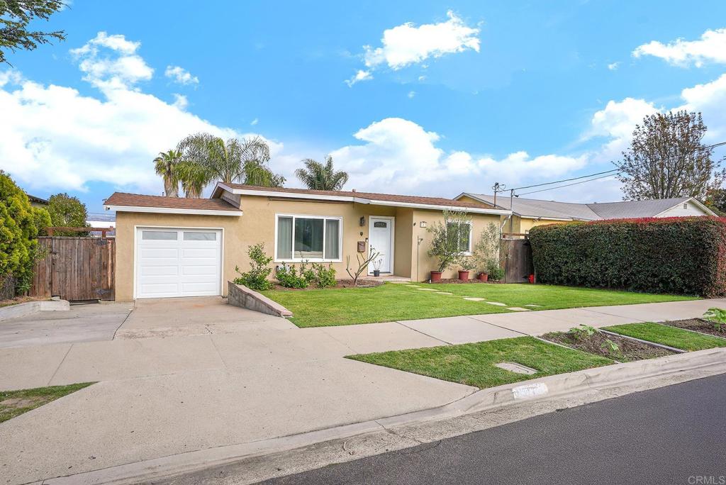 511 El Monte Road El Cajon, CA 92020 - Photo 3 of 30 a front view of a house with a yard and garage