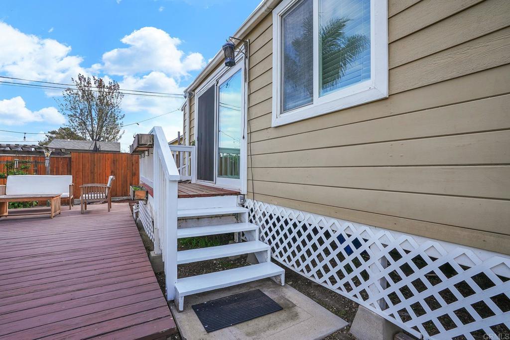 511 El Monte Road El Cajon, CA 92020 - Photo 6 of 30 a view of a balcony with wooden floor and bench