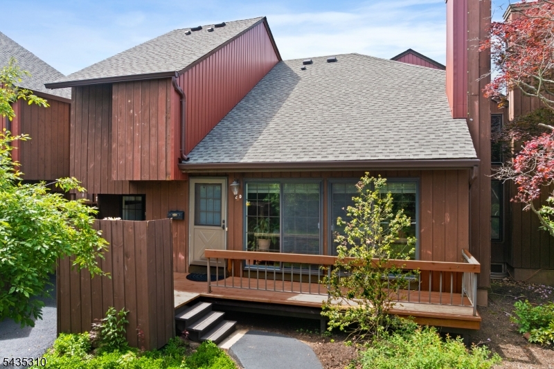 488 Auten Road, Unit 2D Hillsborough, NJ 08844 - Photo 2 of 30 a view of a house with porch and a garden