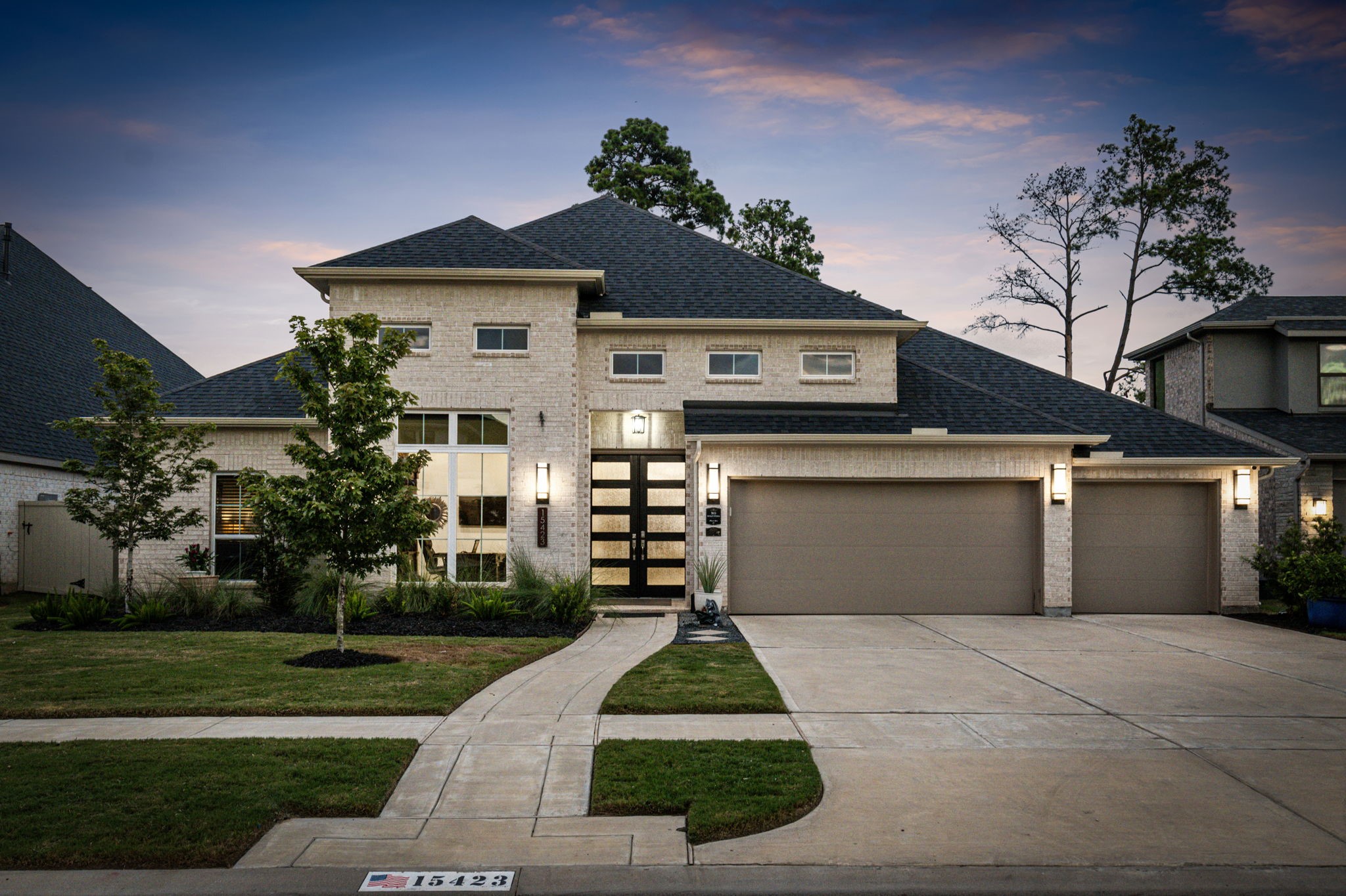 15423 Ringbill Way Magnolia, TX 77354 - Photo 1 of 50 a front view of a house with a yard and potted plants