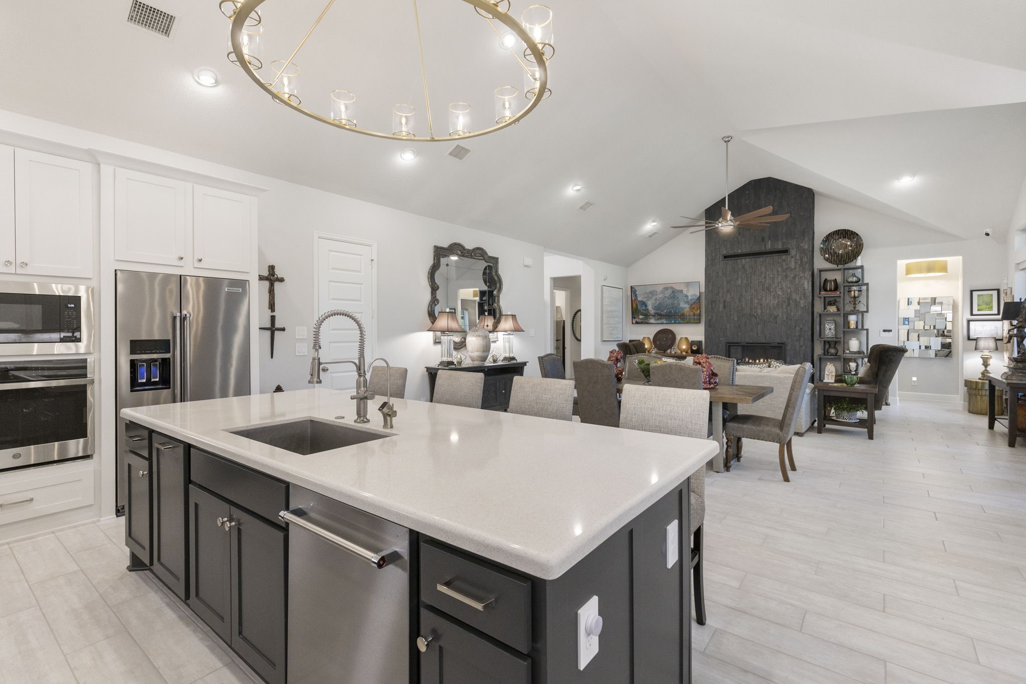 15423 Ringbill Way Magnolia, TX 77354 - Photo 13 of 50 a kitchen with stainless steel appliances granite countertop a sink a stove and a refrigerator