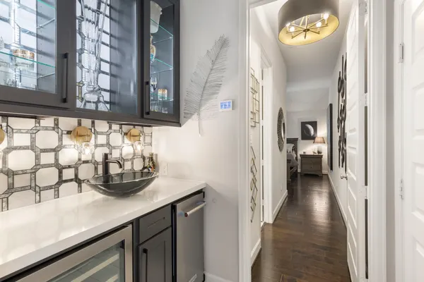 a bathroom with a toilet a sink and a mirror
