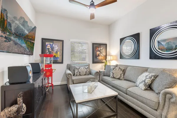 a bedroom with a bed and glass walk in closet
