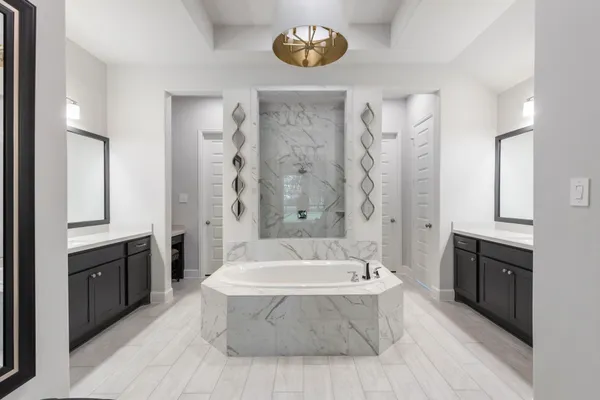 a bathroom with a bathtub and a sink