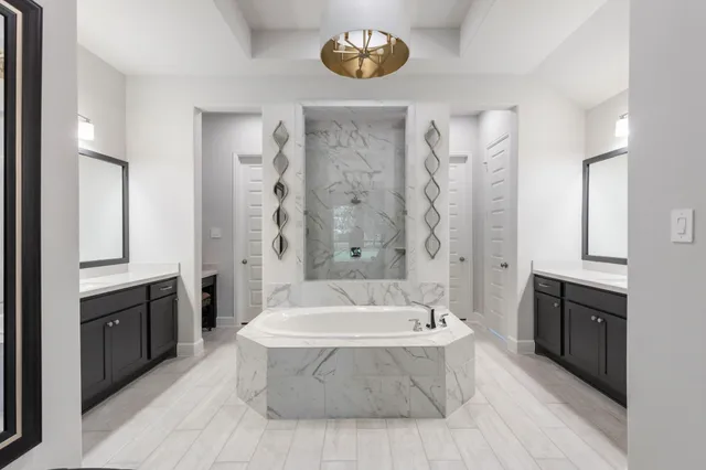 a bathroom with a bathtub and a sink