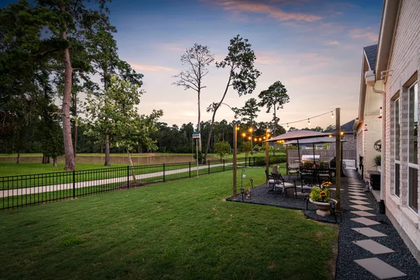 a front view of a house with a garden and patio