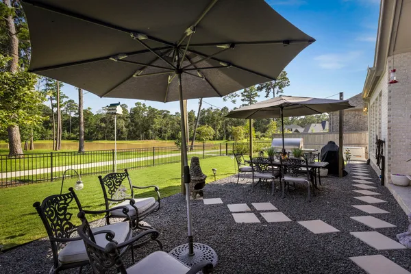 a view of a swimming pool with a yard