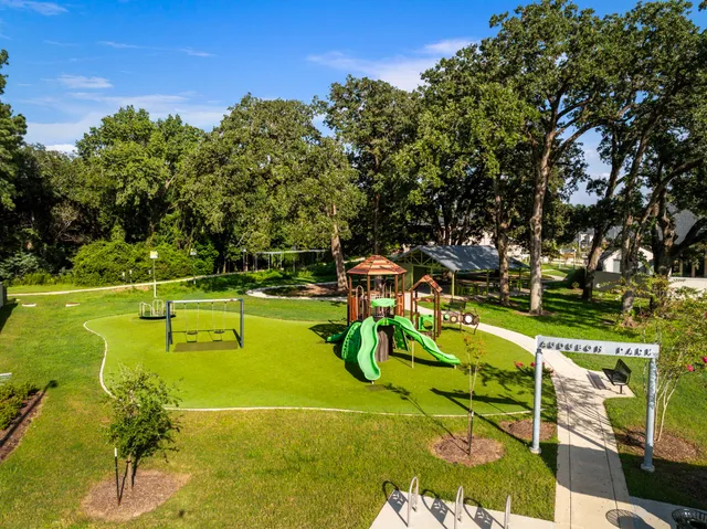 a aerial view of a house with a yard