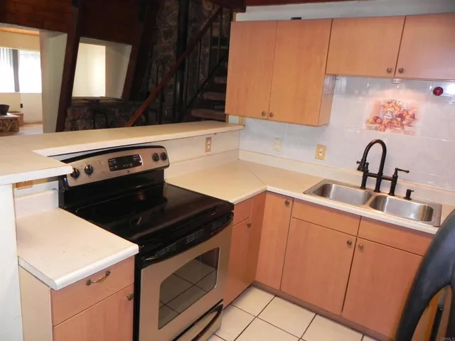 a kitchen with a stove and a sink
