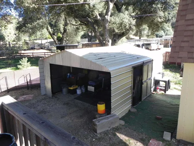 a view of a backyard with sitting area