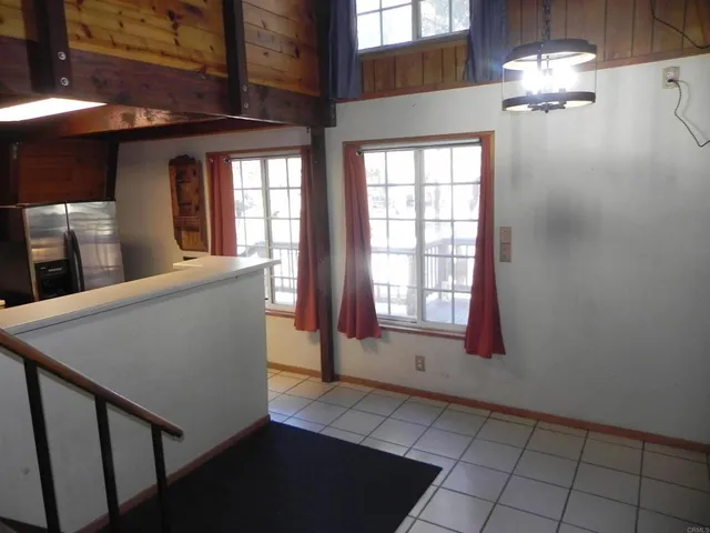 a bathroom with a granite countertop sink toilet a mirror and shower