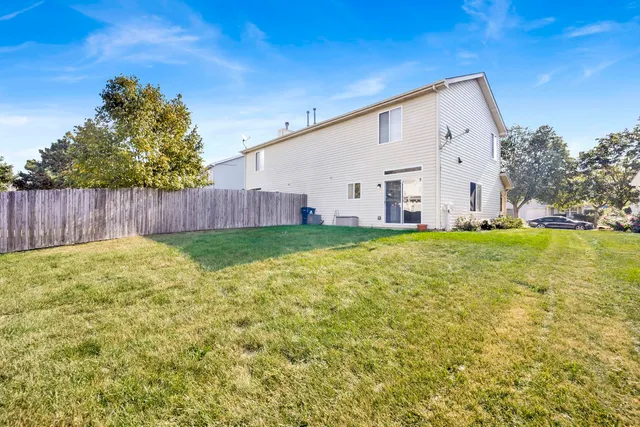 a view of yard with swimming pool and trees