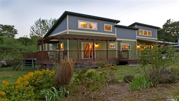 7505 Skidmore Road Sebastopol, CA 95472 - Photo 1 of 1 a view of a house with brick walls and a yard with plants