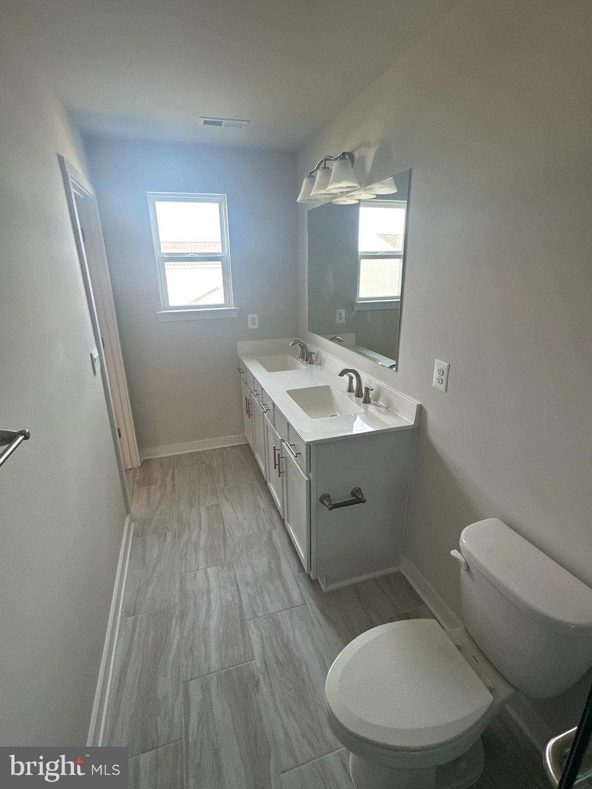 29 Trotting Road Inwood, WV 25428 - Photo 12 of 19 a bathroom with a toilet sink and mirror