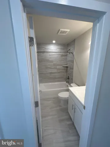 a bedroom with a bed and lamp with window