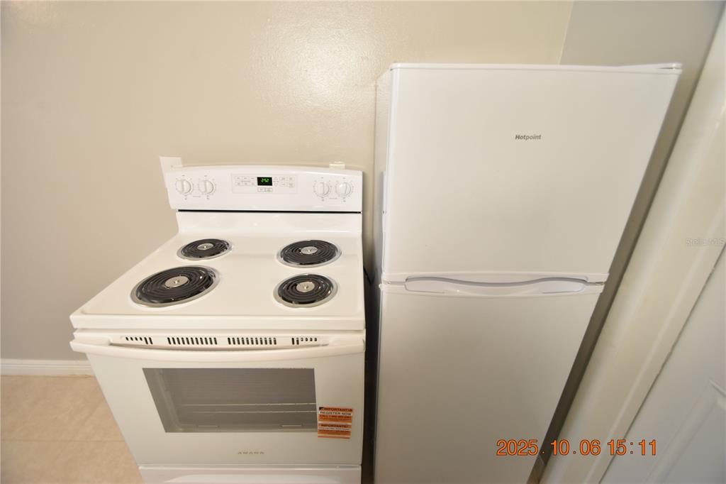 401 Milwaukee Avenue, Unit 401 Dunedin, FL 34698 - Photo 13 of 23 a utility room with dryer and washer