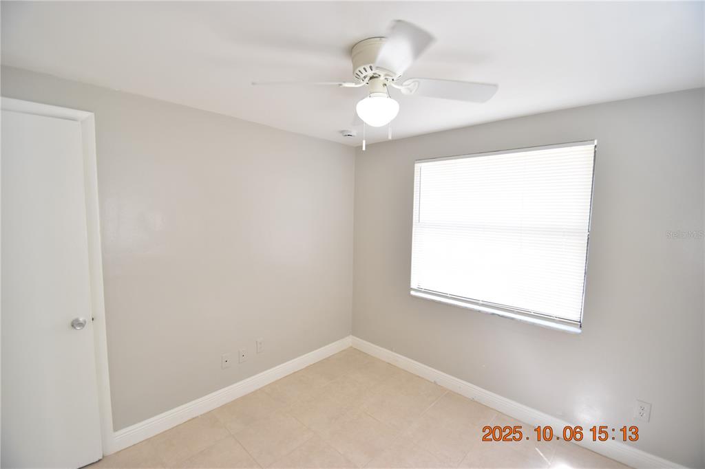 401 Milwaukee Avenue, Unit 401 Dunedin, FL 34698 - Photo 20 of 23 an empty room with a window
