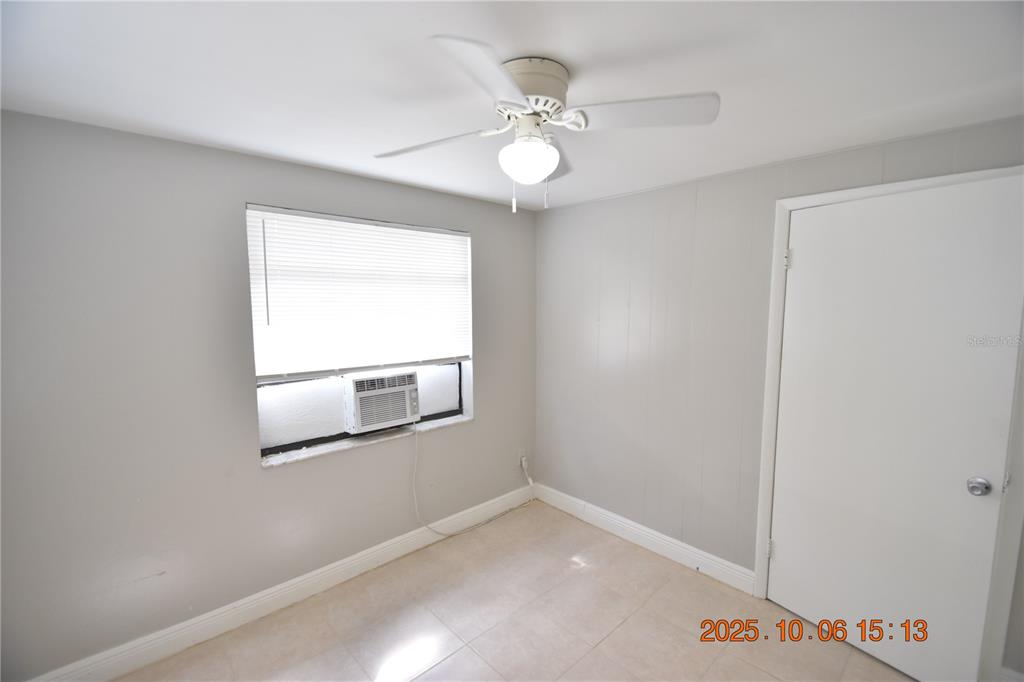 401 Milwaukee Avenue, Unit 401 Dunedin, FL 34698 - Photo 22 of 23 an empty room with a window