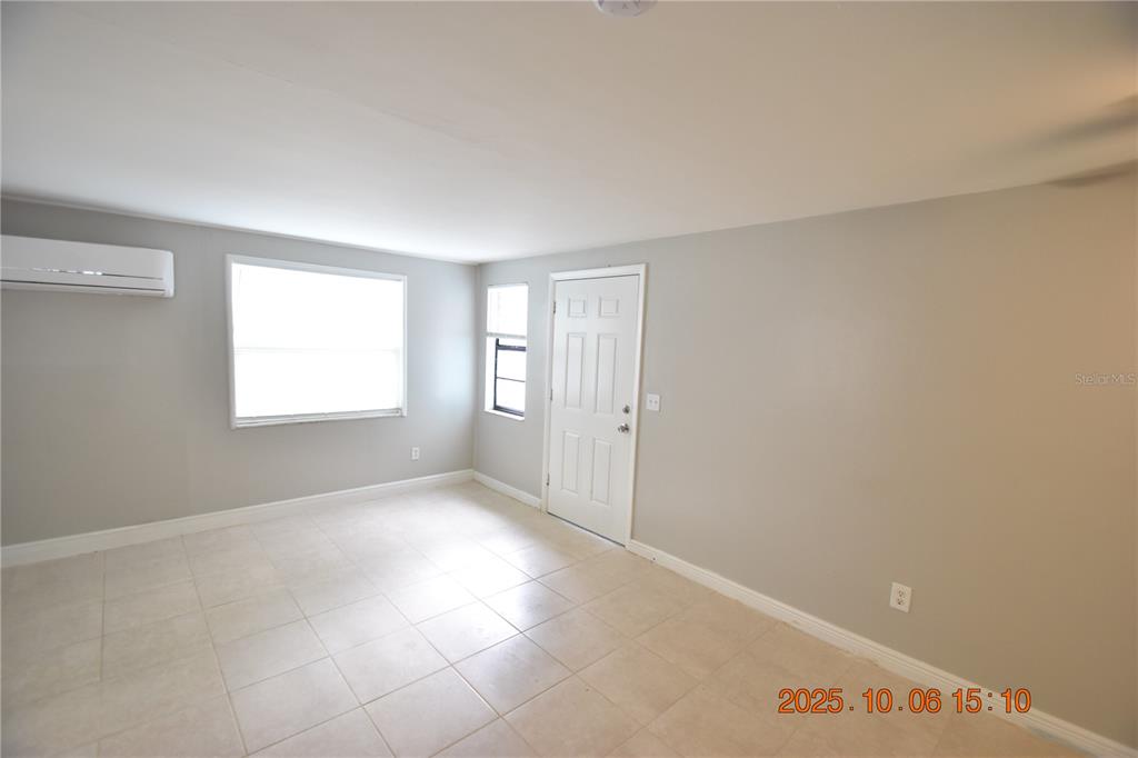 401 Milwaukee Avenue, Unit 401 Dunedin, FL 34698 - Photo 7 of 23 a view of an empty room with a window