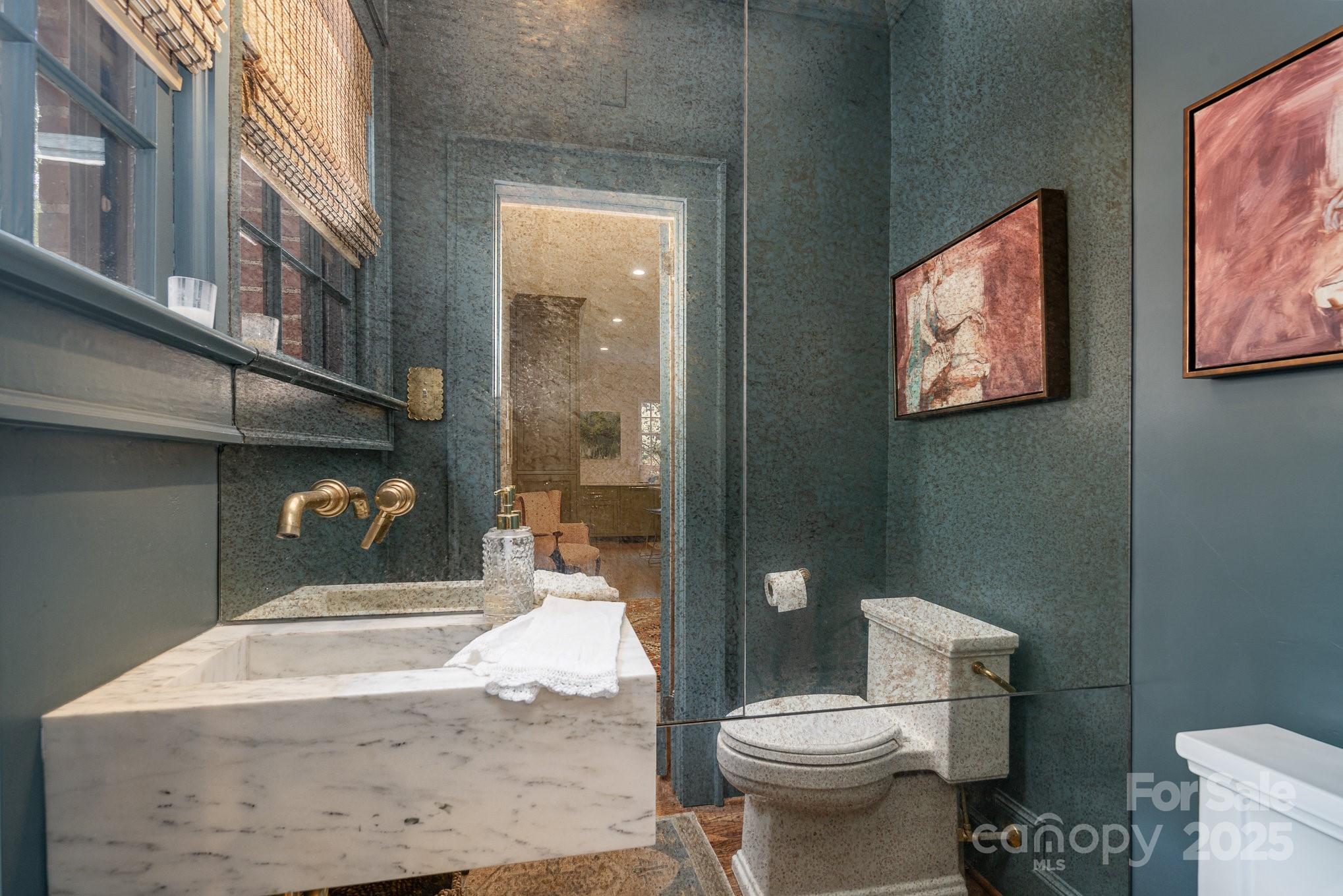 2120 Malvern Road Charlotte, NC 28207 - Photo 15 of 48 a bathroom with a toilet sink and mirror