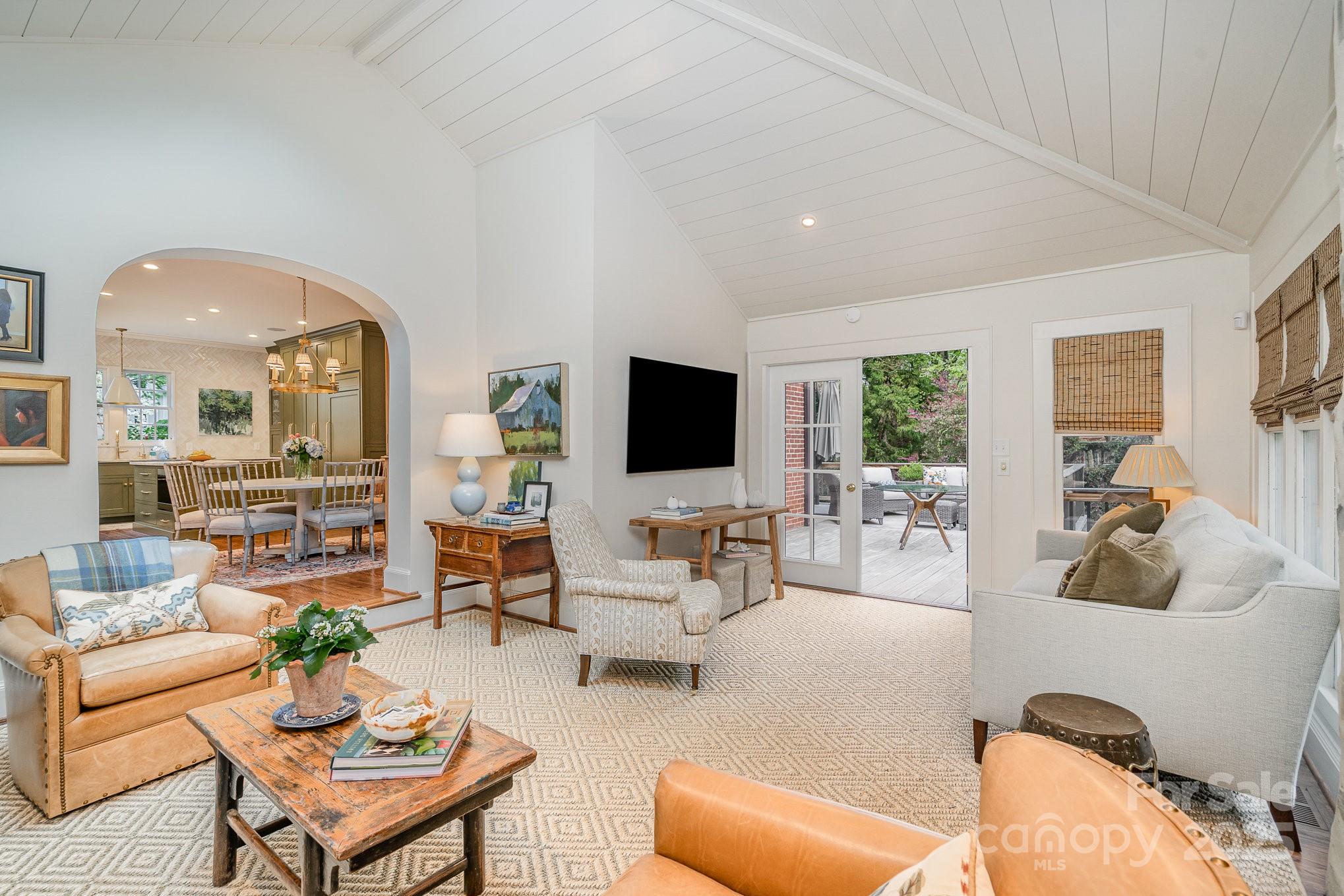 2120 Malvern Road Charlotte, NC 28207 - Photo 16 of 48 a living room with furniture and a flat screen tv