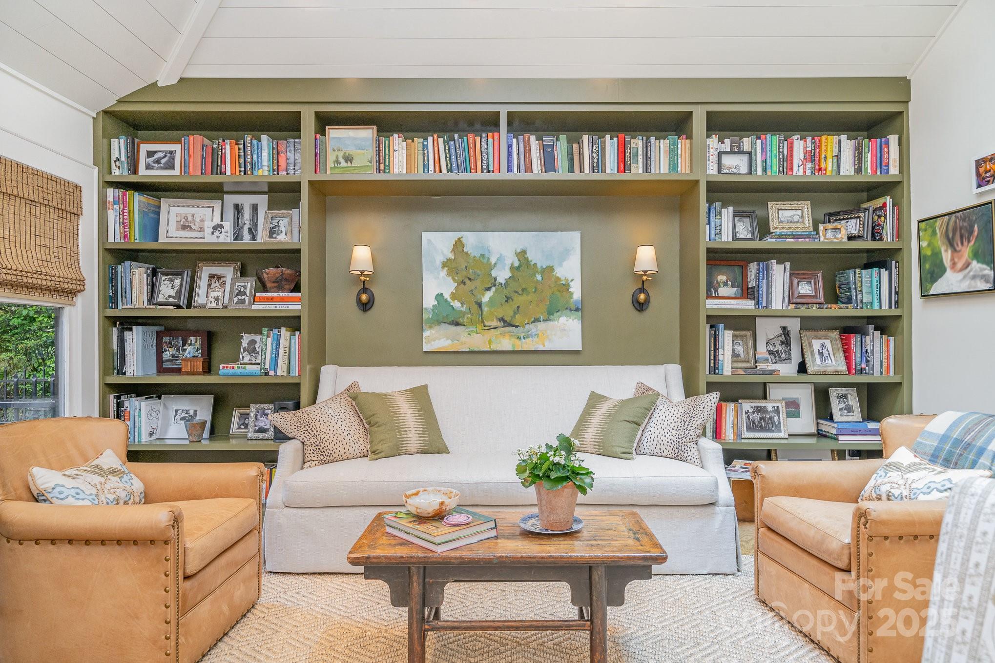 2120 Malvern Road Charlotte, NC 28207 - Photo 19 of 48 a living room with furniture and a book shelf
