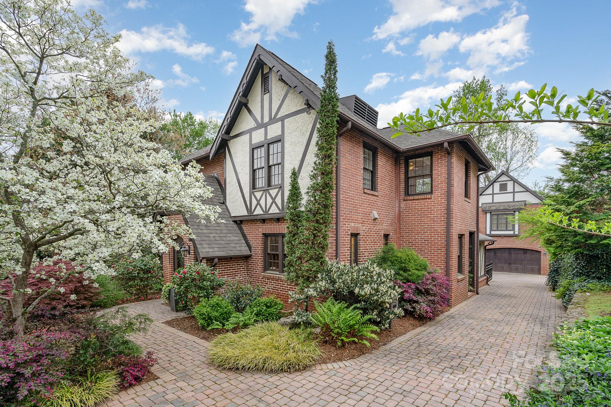 2120 Malvern Road Charlotte, NC 28207 - Photo 2 of 48 a front view of a house with a yard